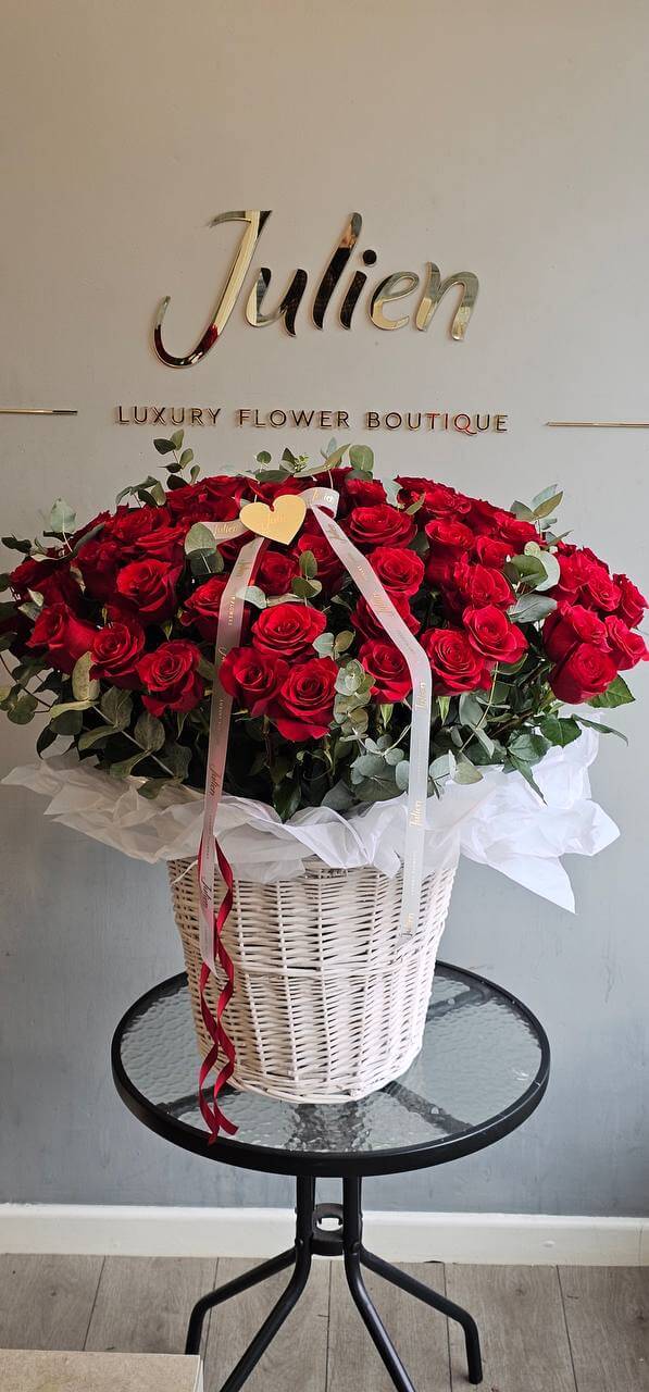 100 red roses in a basket
