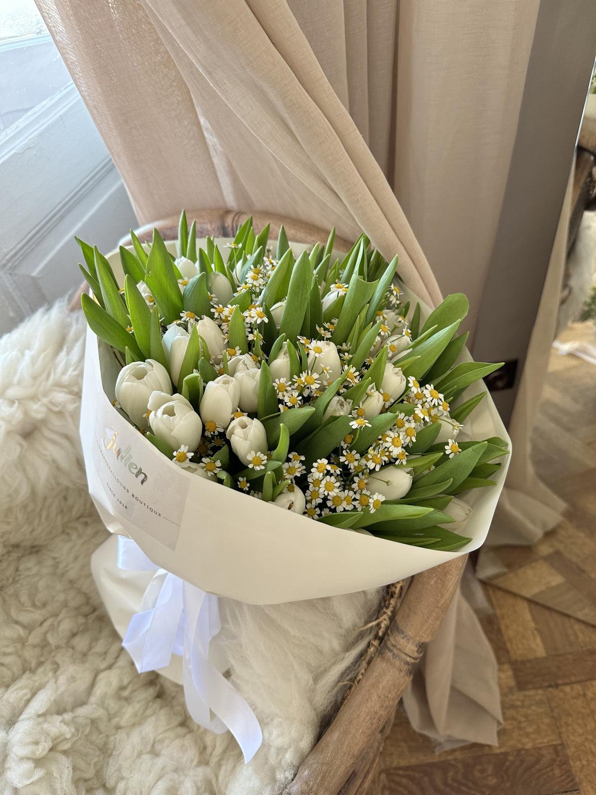 50 white tulips with chamomile